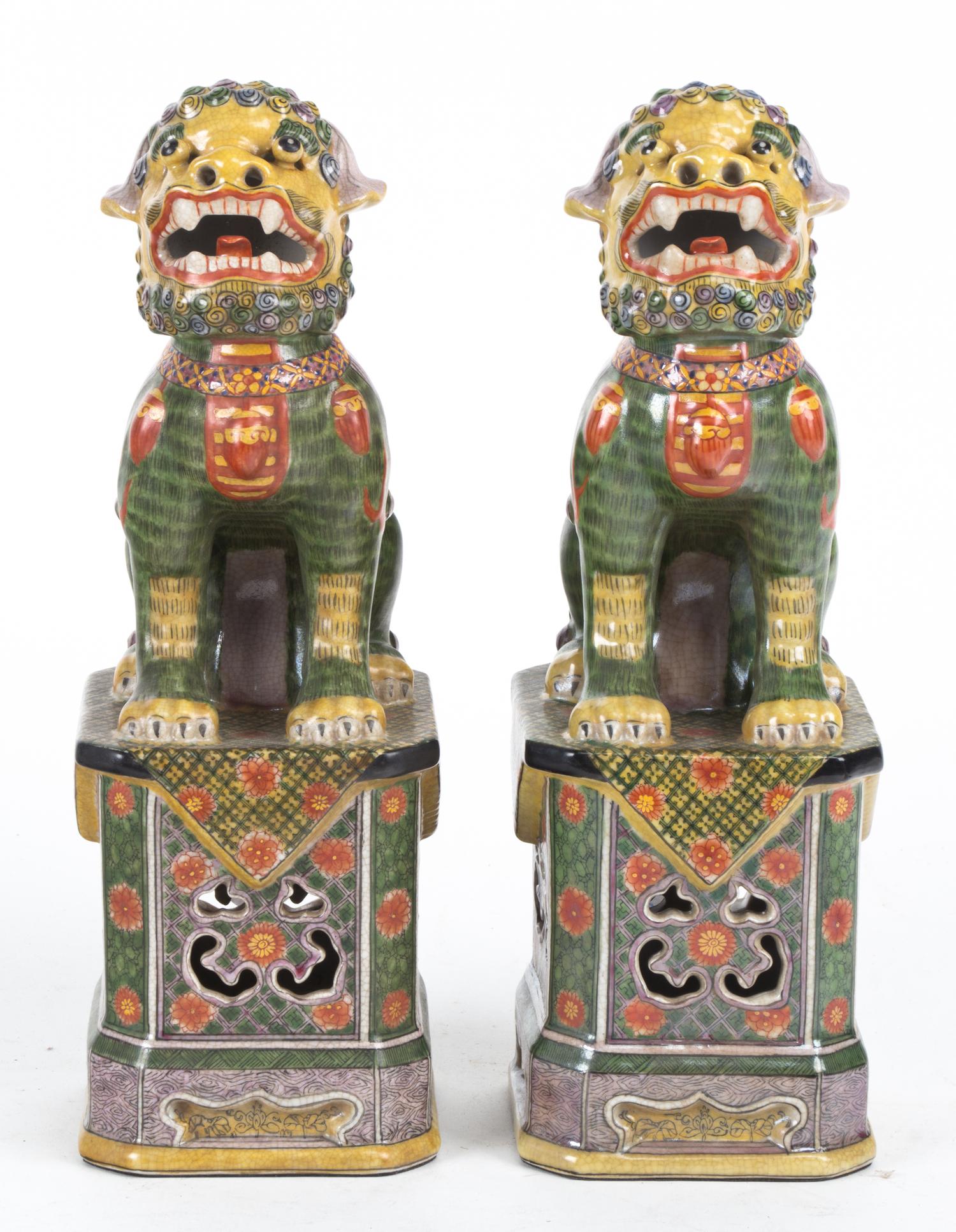A Pair of Chinese Porcelain Foo Dogs Height 12 1/2 inches.