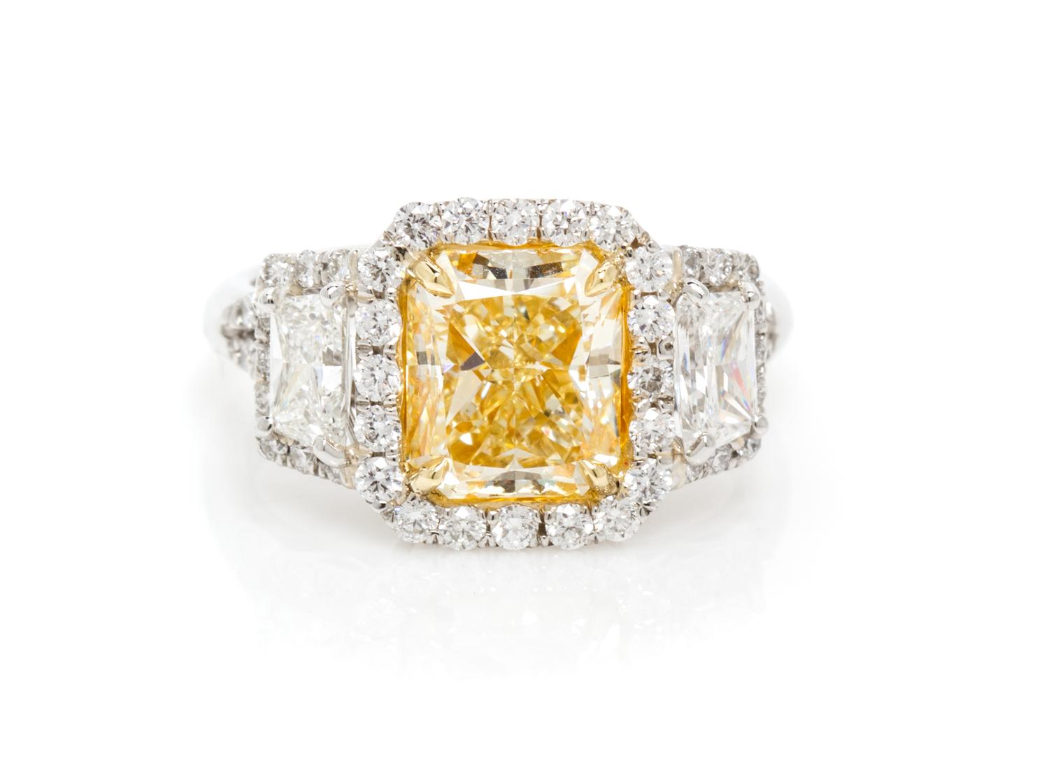 A Platinum, Yellow Gold, Fancy Intense Yellow Diamond and Diamond Ring, 5.20 dwts.