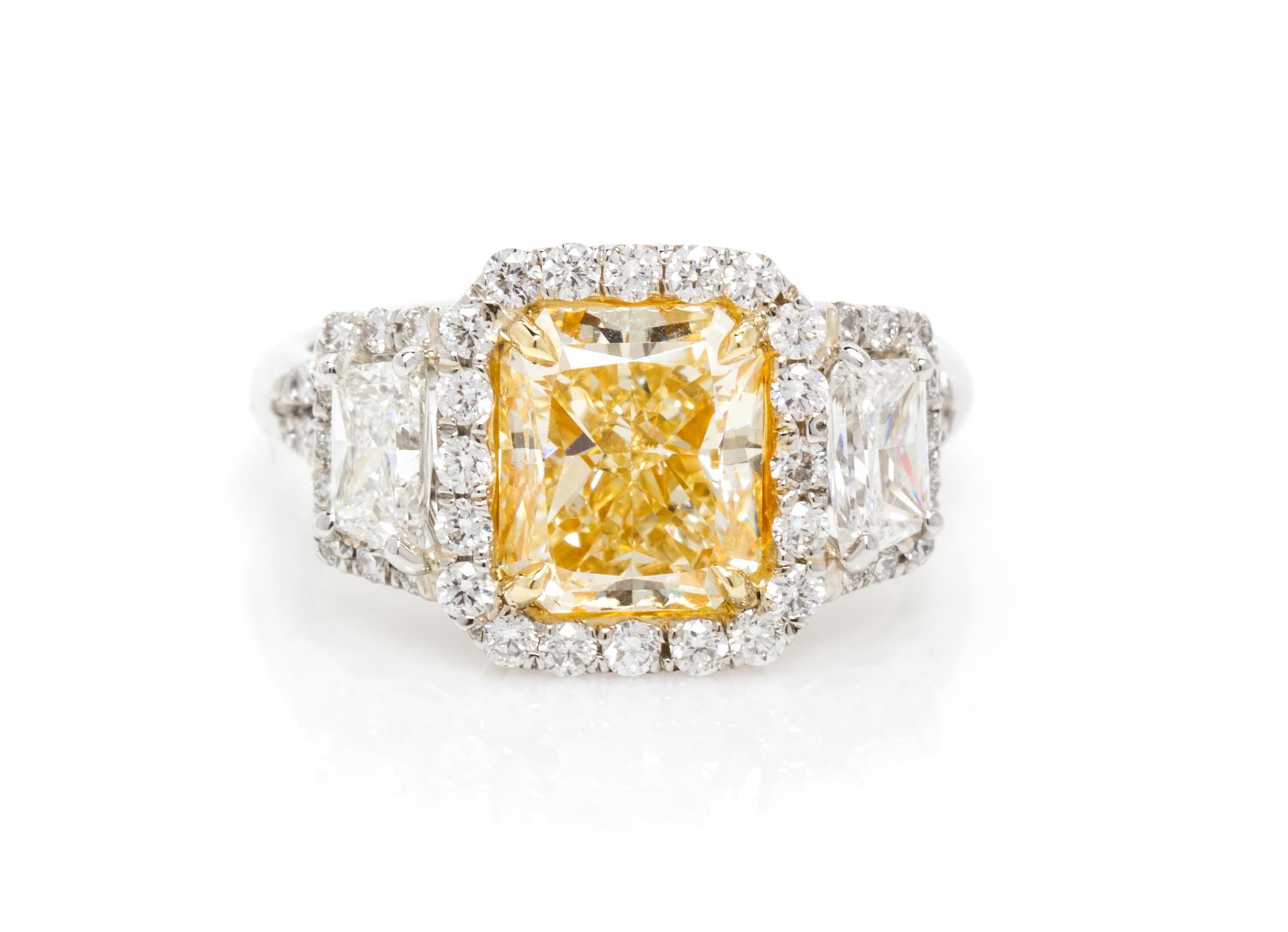 A Platinum, Yellow Gold, Fancy Intense Yellow Diamond and Diamond Ring, 5.20 dwts.
