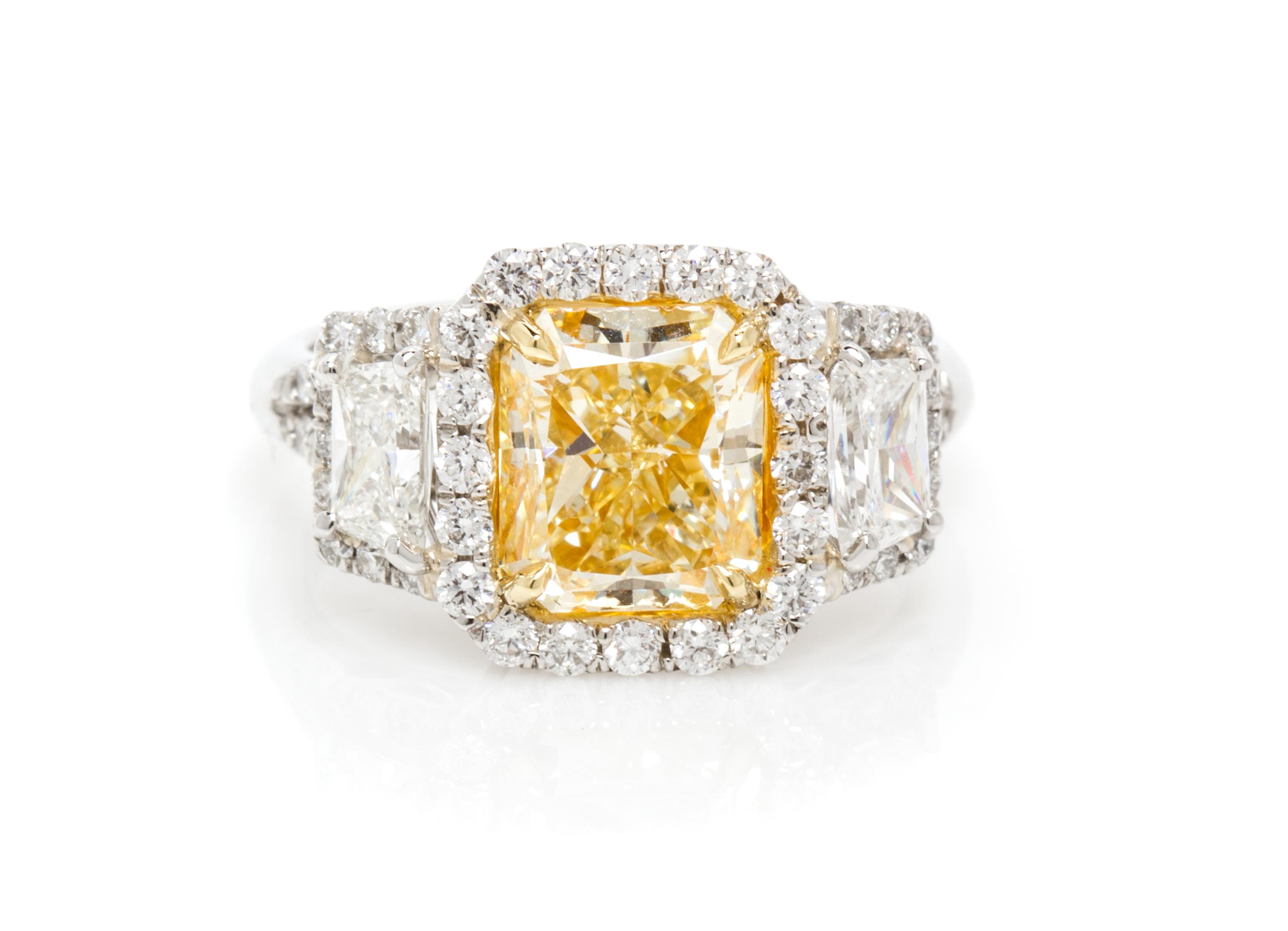 A Platinum, Yellow Gold, Fancy Intense Yellow Diamond and Diamond Ring, 5.20 dwts.