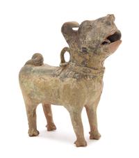 A Chinese Green Glazed Pottery Figure of a Dog Height 13 1/4 inches. — HAN DYNASTY (206 B.C. - A.D. 220)