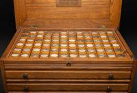 An Oak Three-Drawer Apothecary Cabinet with Specimen Tins