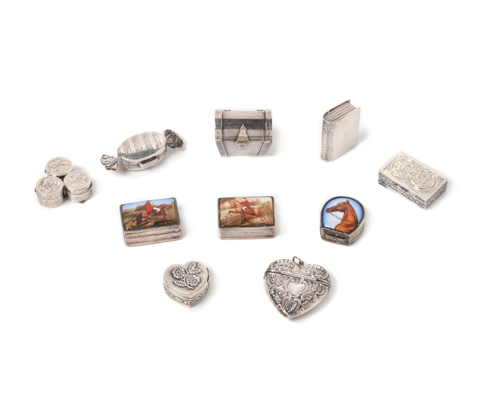A Group of Ten Silver Pill Boxes