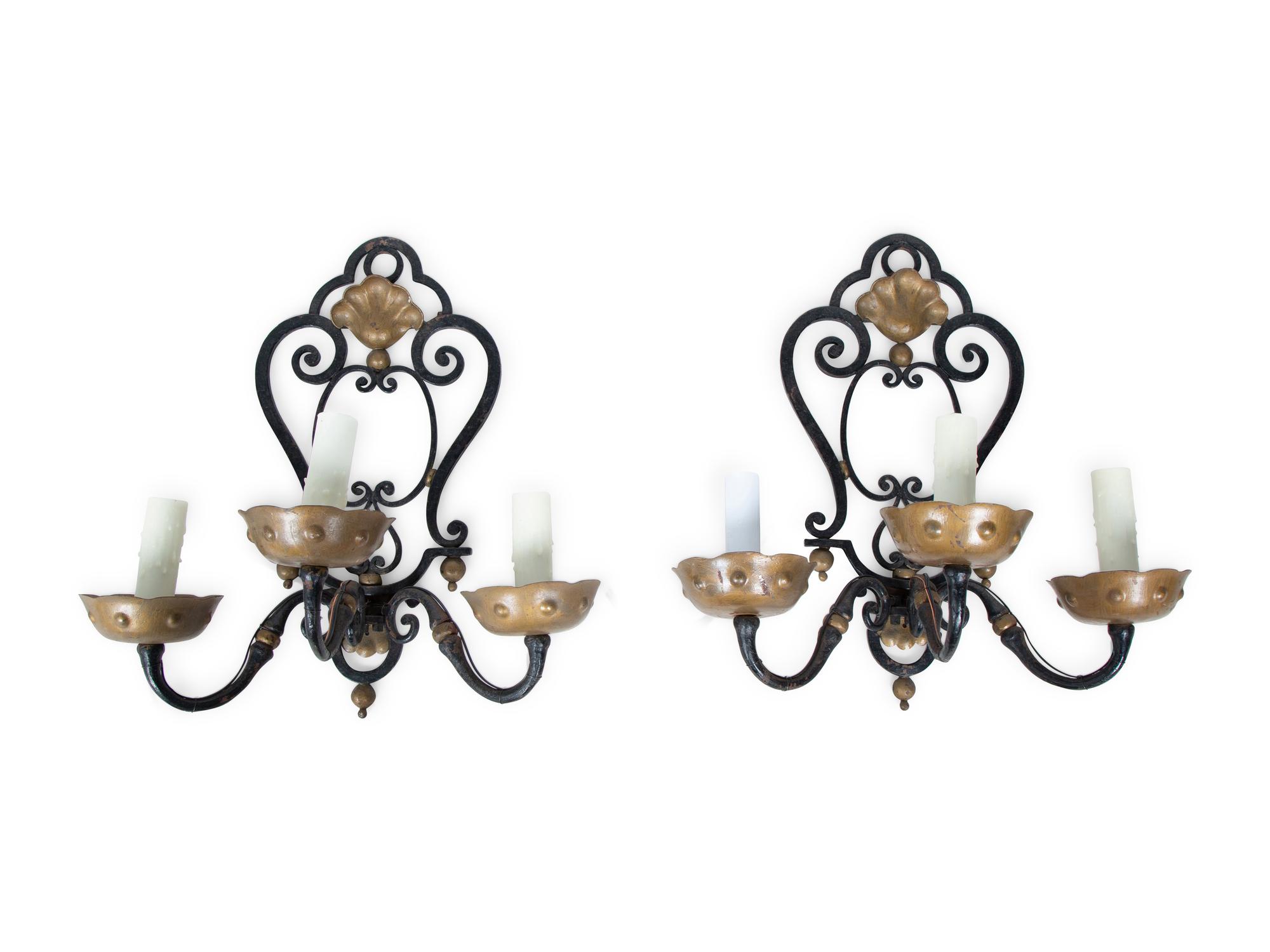 A Pair of French Wrought Iron Three-Arm Sconces