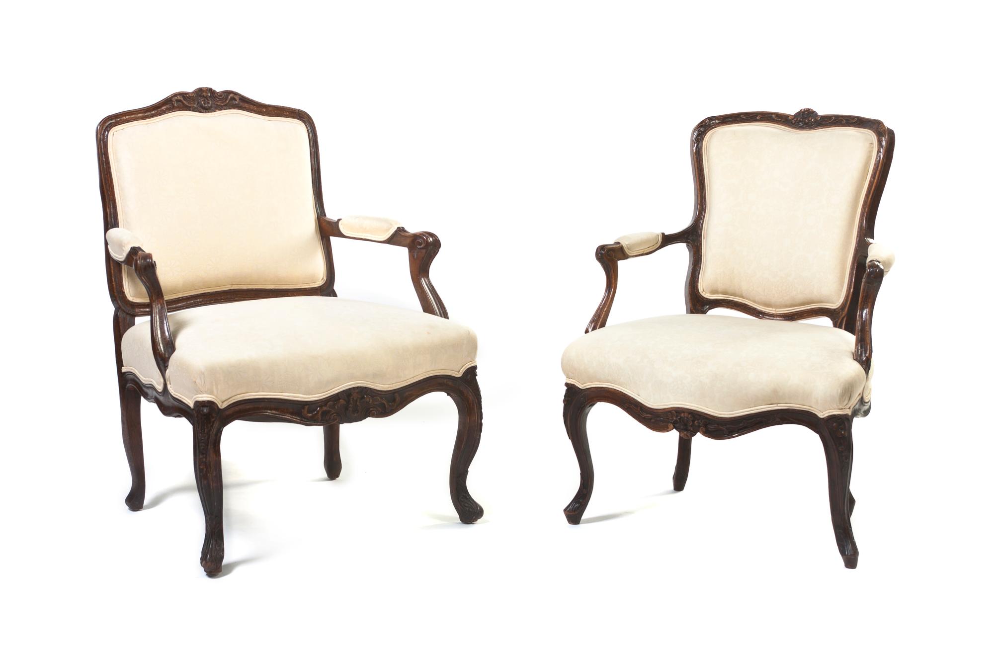A Near Pair of Louis XV Style Oak Fauteuils, Height of taller 36 inches.