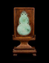 An Apple Green and Pale Celadon Jadeite Inset Hardwood Table Screen