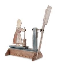 A Folk Art Carved and Painted Wood Butter Churn Whirligig