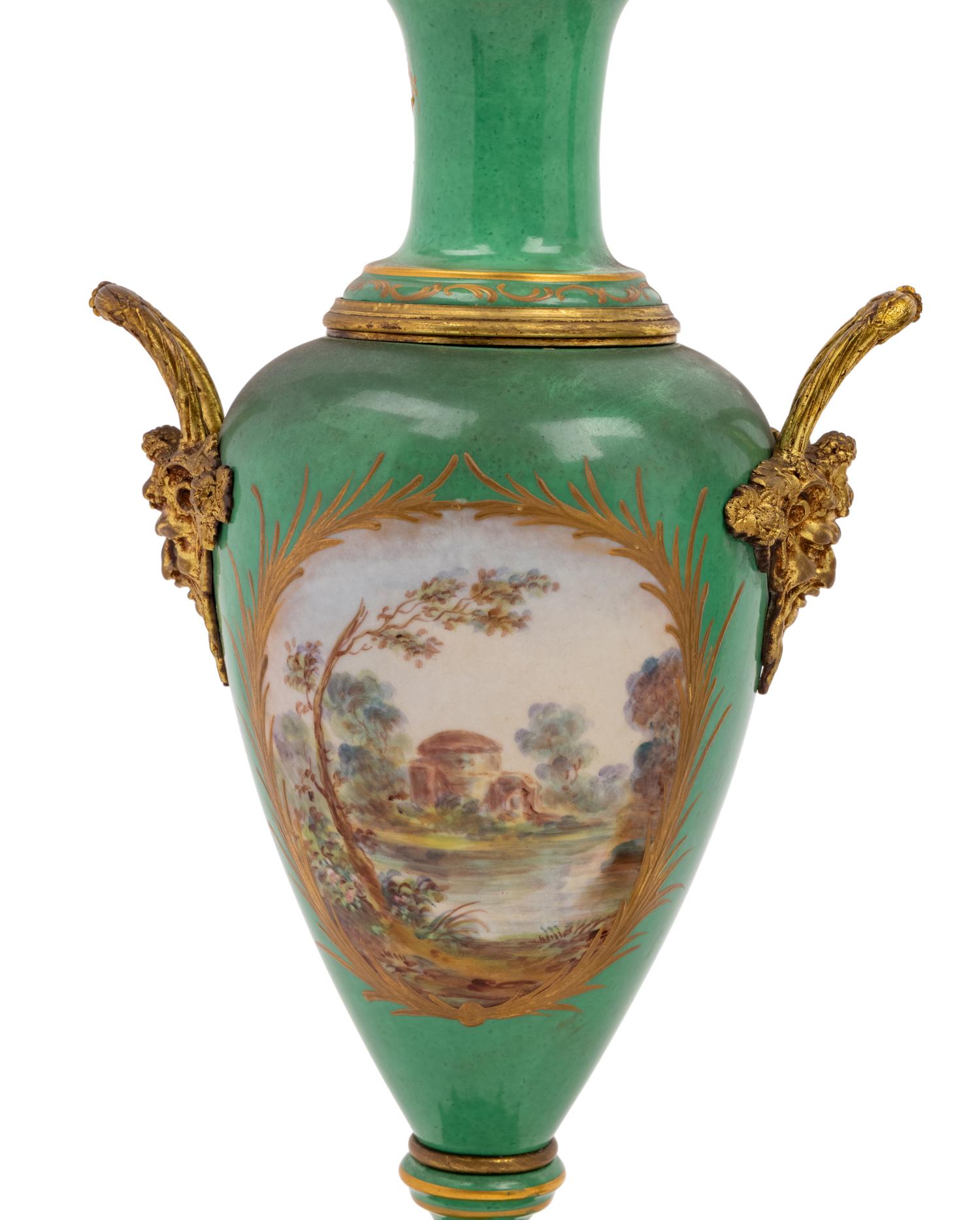A Pair of Sèvres Style Gilt Metal Mounted Porcelain Urns