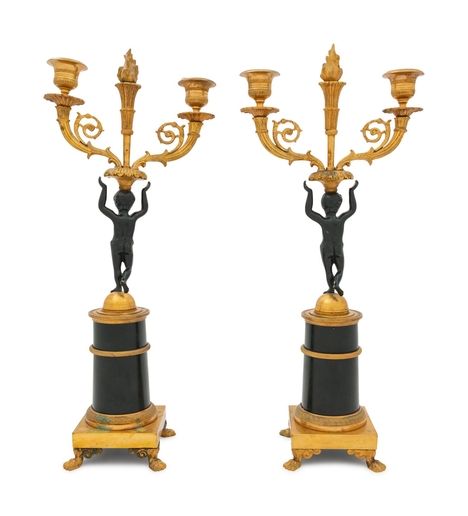 A Pair of Empire Gilt and Patinated Bronze Figural Candlesticks