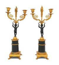 A Pair of Empire Gilt and Patinated Bronze Figural Candlesticks