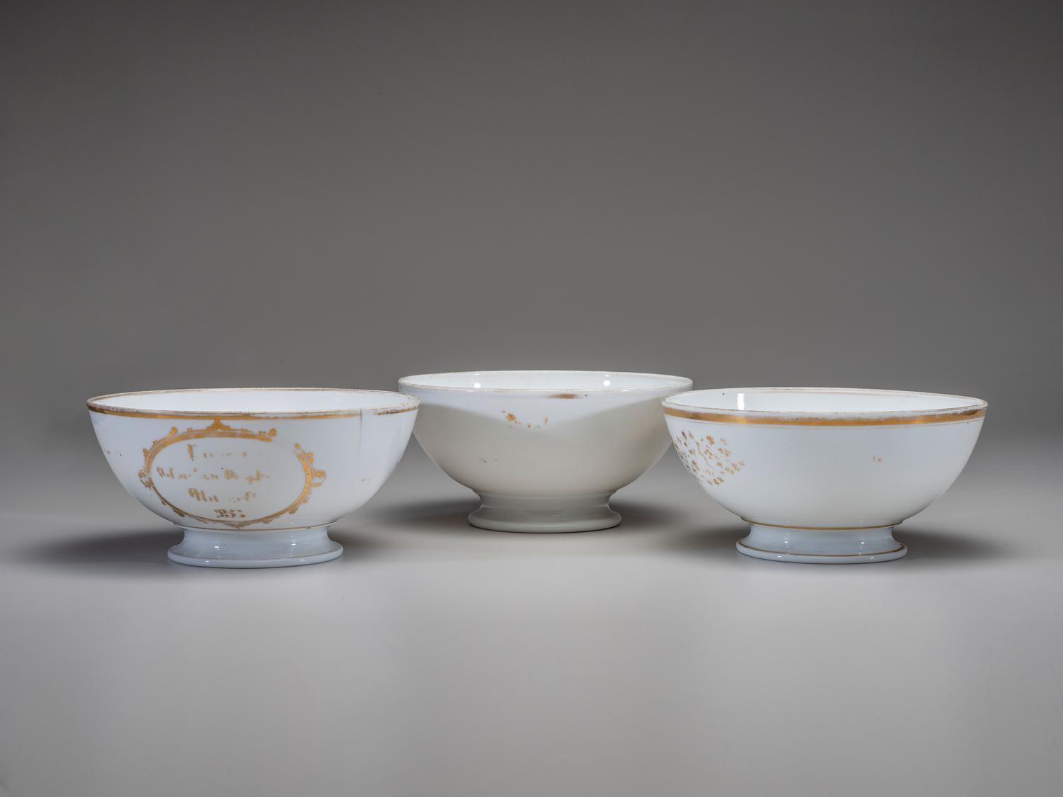 Three English Parcel Gilt and Hand-Painted Porcelain Bowls