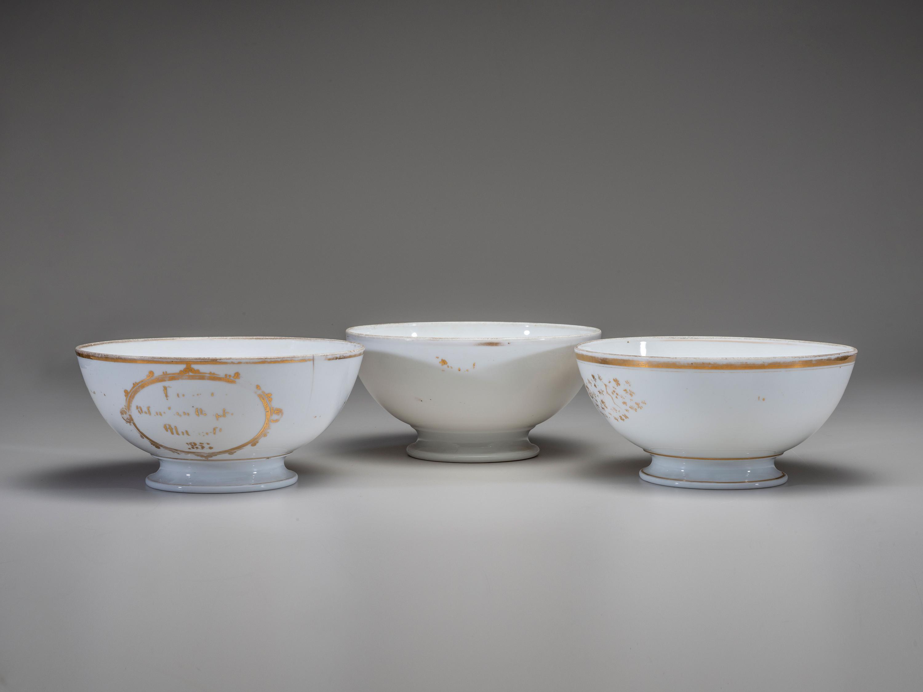 Three English Parcel Gilt and Hand-Painted Porcelain Bowls