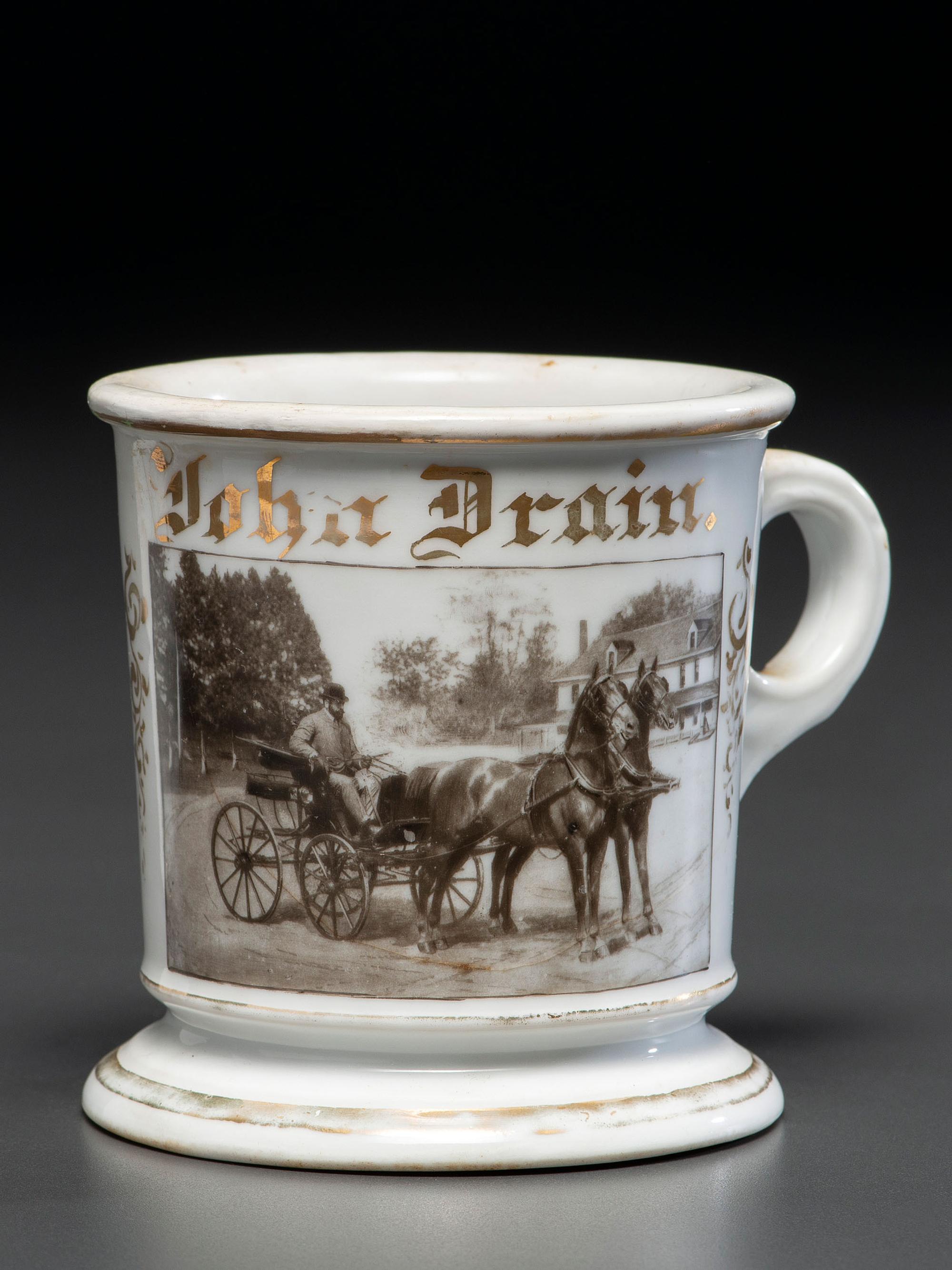 A Photographic Transfer Porcelain Shaving Mug Depicting a Man Driving a Horse and Buggy