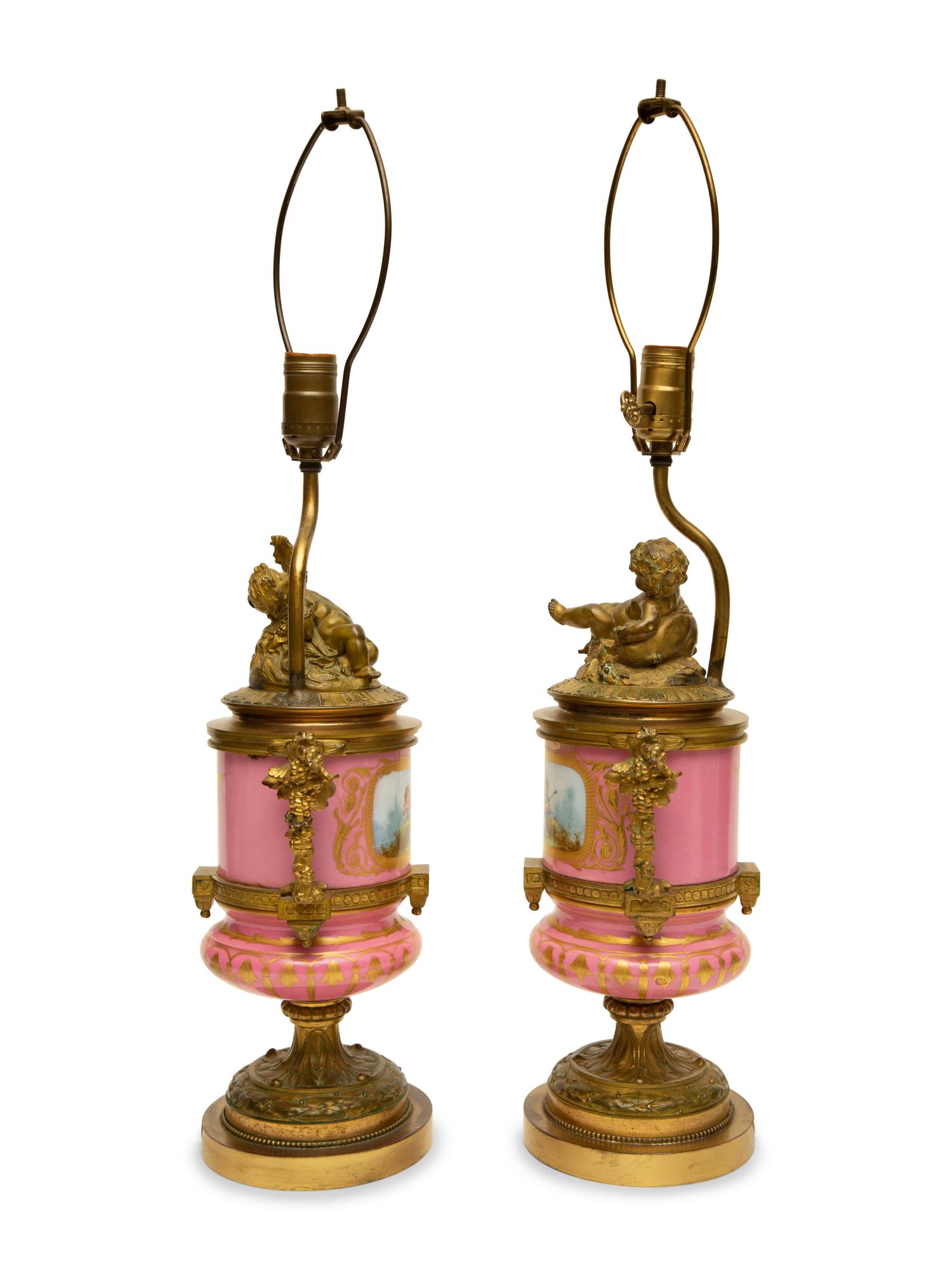 A Pair of Gilt Bronze Mounted Sèvres Style Porcelain Urns Mounted as Lamps