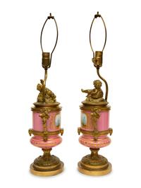 A Pair of Gilt Bronze Mounted Sèvres Style Porcelain Urns Mounted as Lamps