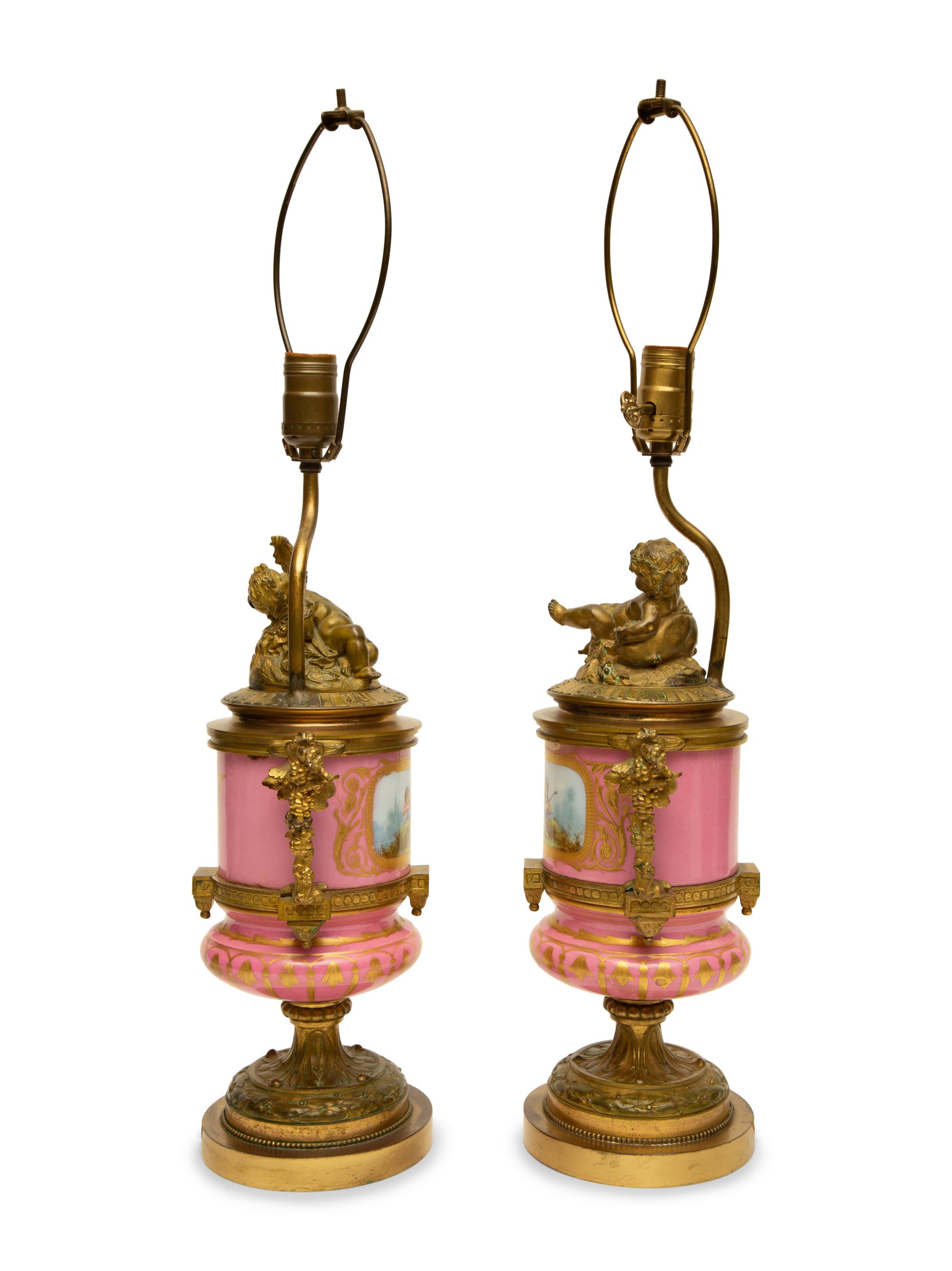 A Pair of Gilt Bronze Mounted Sèvres Style Porcelain Urns Mounted as Lamps