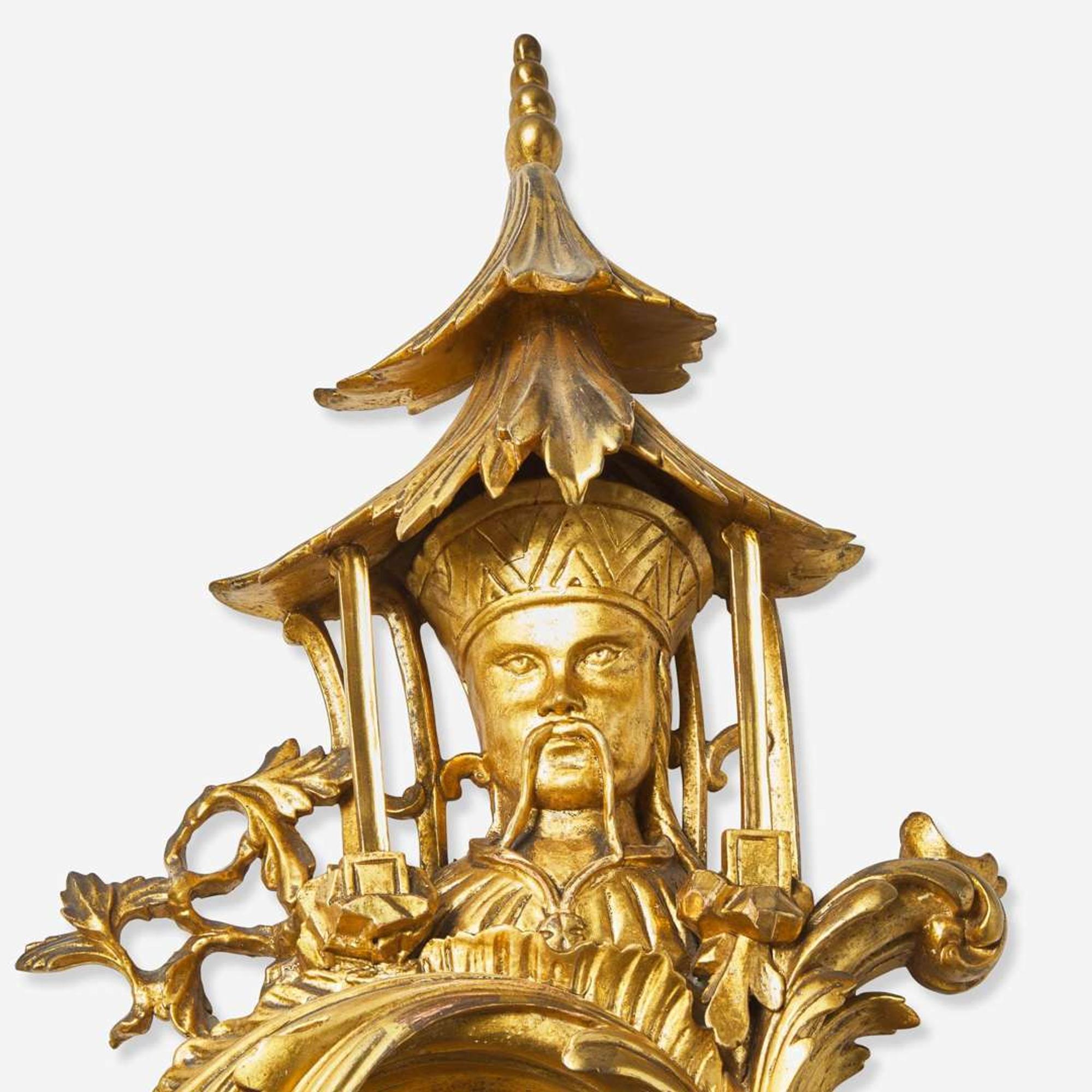 A pair of George III style giltwood mirrors in the Chinese taste early 20th century