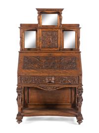 A Renaissance Revival Carved Oak Slant-Front Bureau