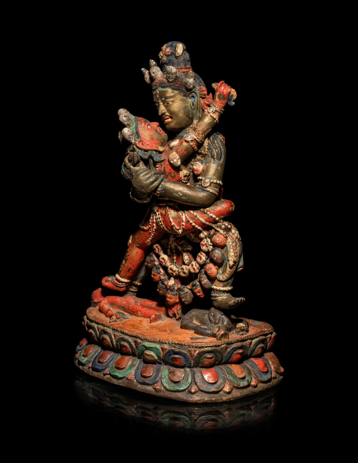 A Tibetan or Bhutanese Polychromed Wood Figure of Chakrasamvara and Consort