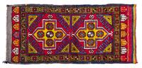 A Turkish Wool Rug 4 feet 7 inches x 2 feet 2 inches.