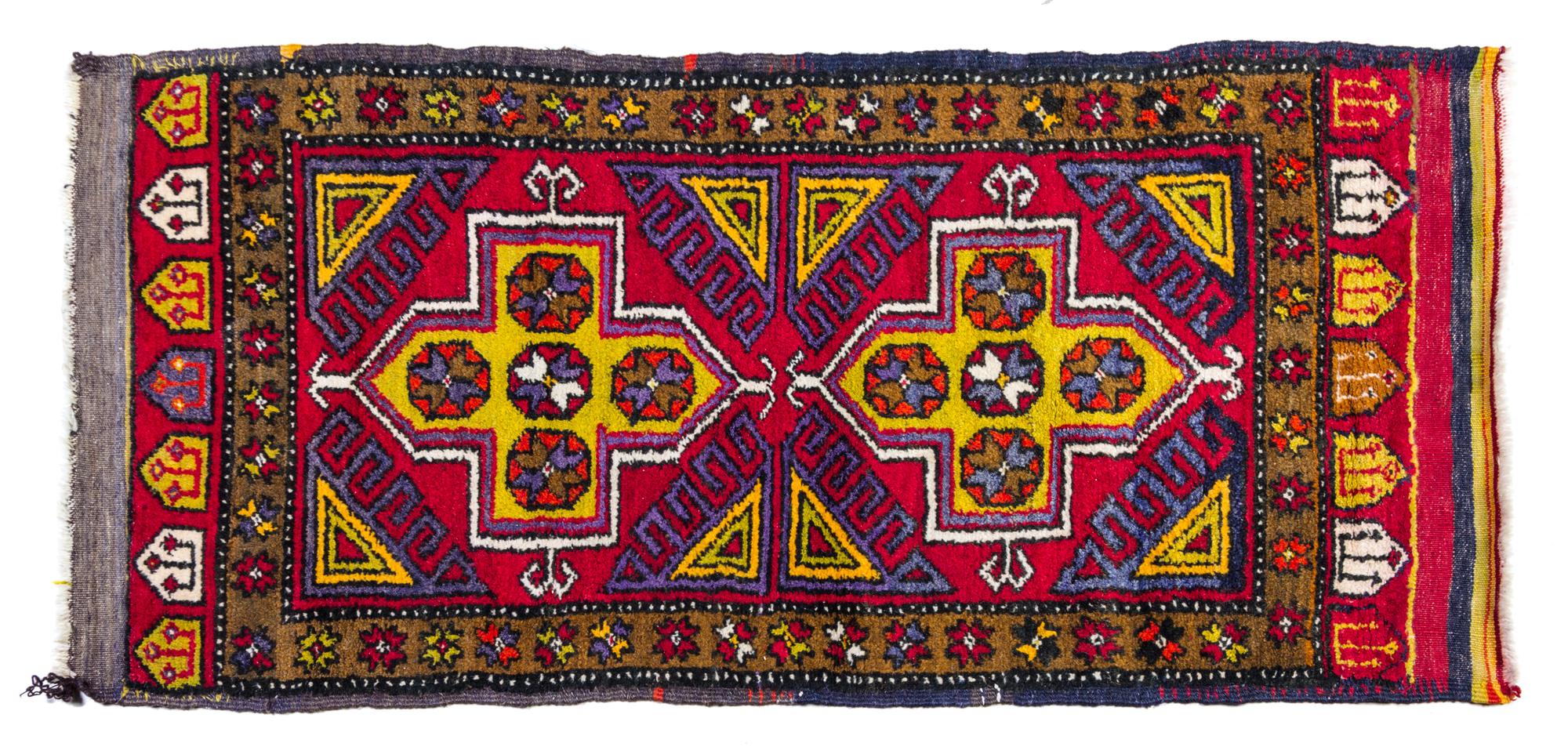 A Turkish Wool Rug 4 feet 7 inches x 2 feet 2 inches.