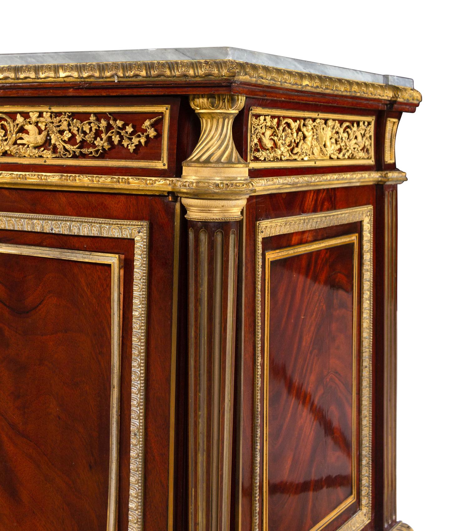 A Louis XVI Style Gilt Bronze Mounted Mahogany Marble-Top Cabinet After the Model by Jean-Henri Riesener (German, 1734-1806)