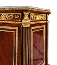 A Louis XVI Style Gilt Bronze Mounted Mahogany Marble-Top Cabinet After the Model by Jean-Henri Riesener (German, 1734-1806)