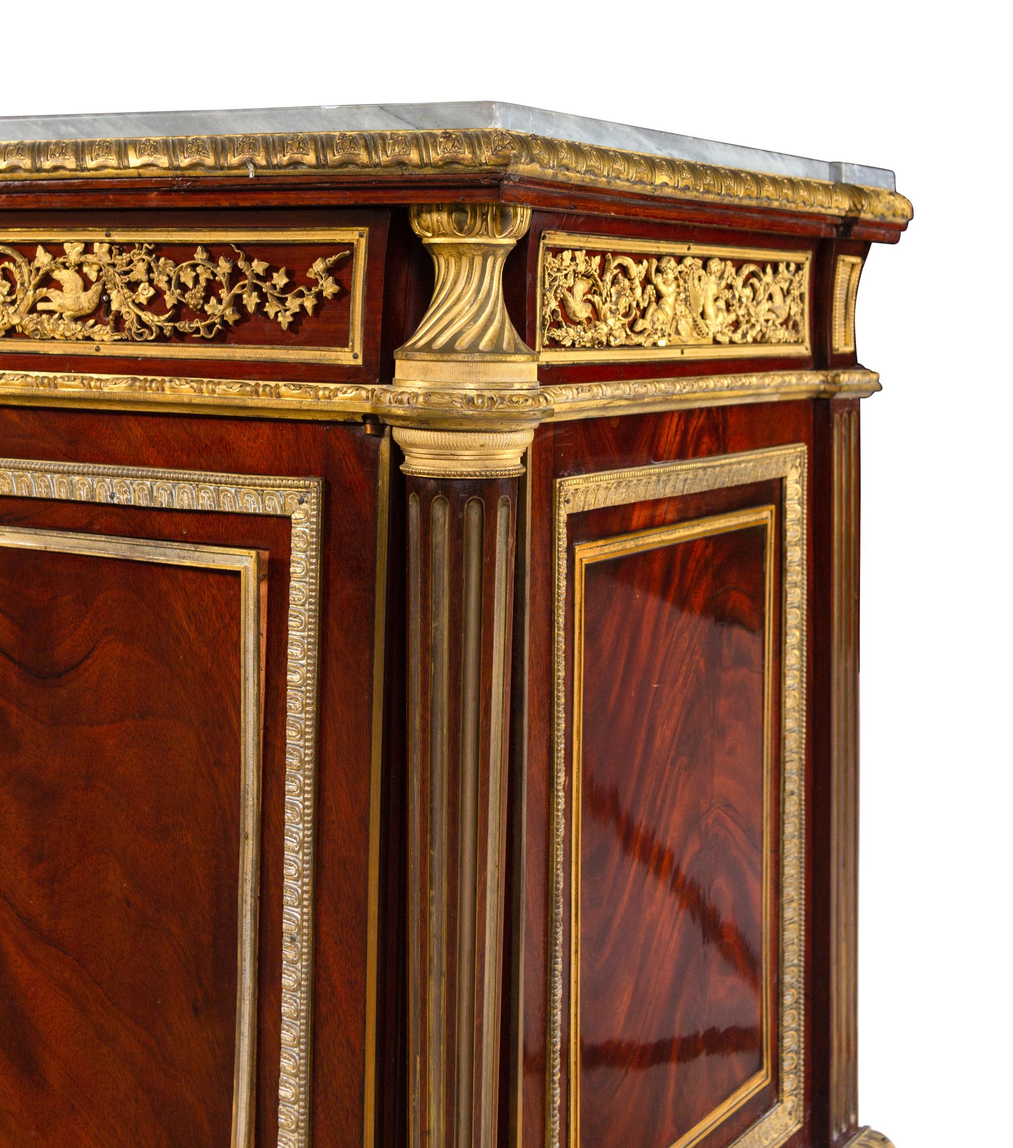 A Louis XVI Style Gilt Bronze Mounted Mahogany Marble-Top Cabinet After the Model by Jean-Henri Riesener (German, 1734-1806)