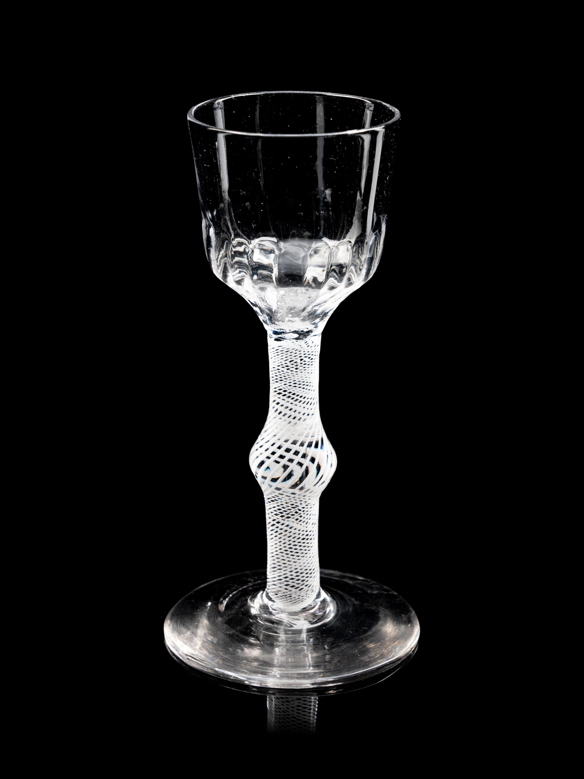 Two Moulded Glass Wine Glasses