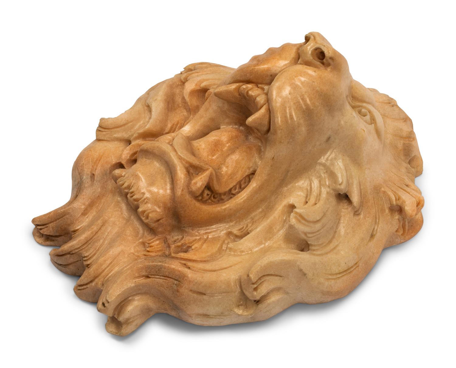 A Continental Carved Marble Lion Mask