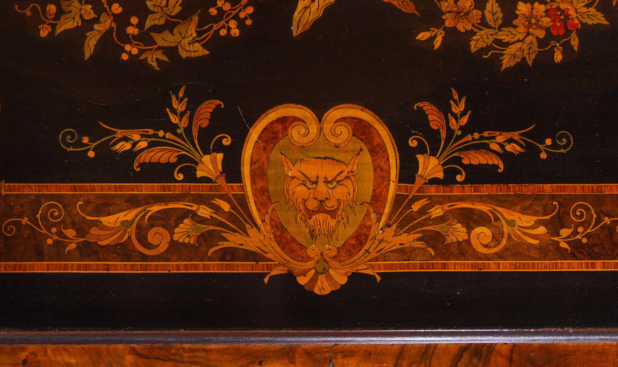 A Victorian Carved, Inlaid and Painted Walnut Writing Desk