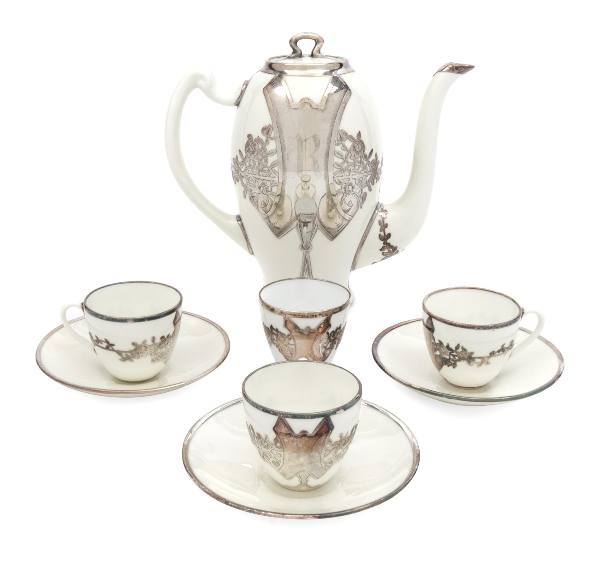 An English Silver Overlay Porcelain Partial Coffee Service Height of coffee pot 7 1/2 inches.