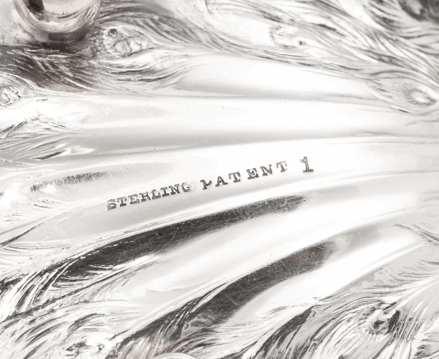 A Collection of Ten American Silver Peacock Table Ornaments