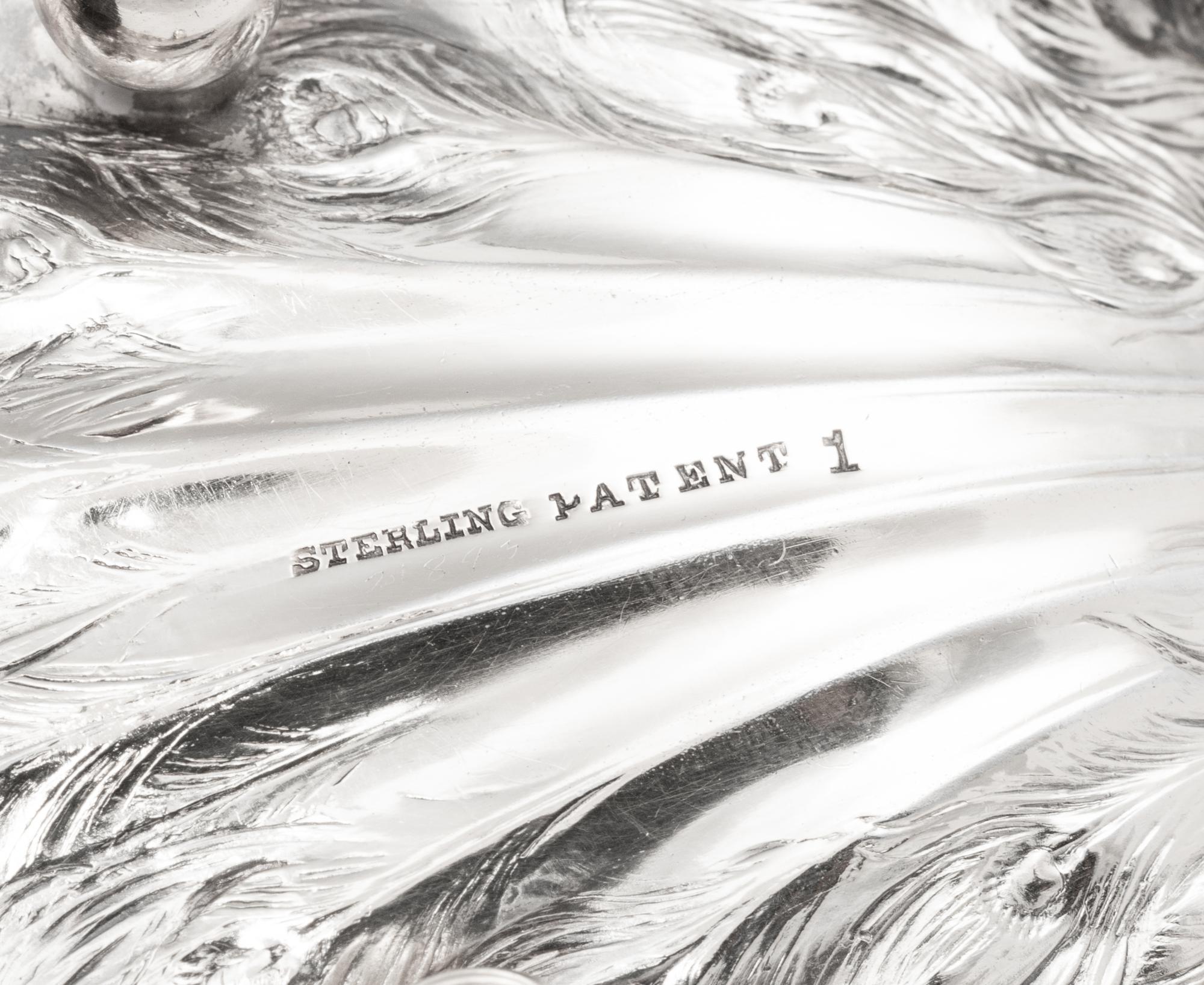 A Collection of Ten American Silver Peacock Table Ornaments