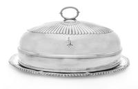 A Mexican Silver Dish, , having an undulating gadrooned rim, together with a silver-plate cloche with an engraved coat of arms.