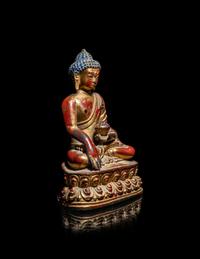 A Tibetan/Nepalese Gilt and Red Lacquered Bronze Figure of Buddha