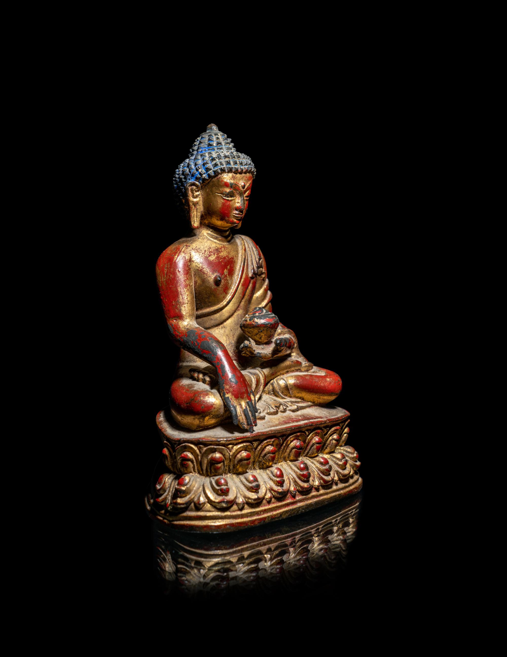 A Tibetan/Nepalese Gilt and Red Lacquered Bronze Figure of Buddha