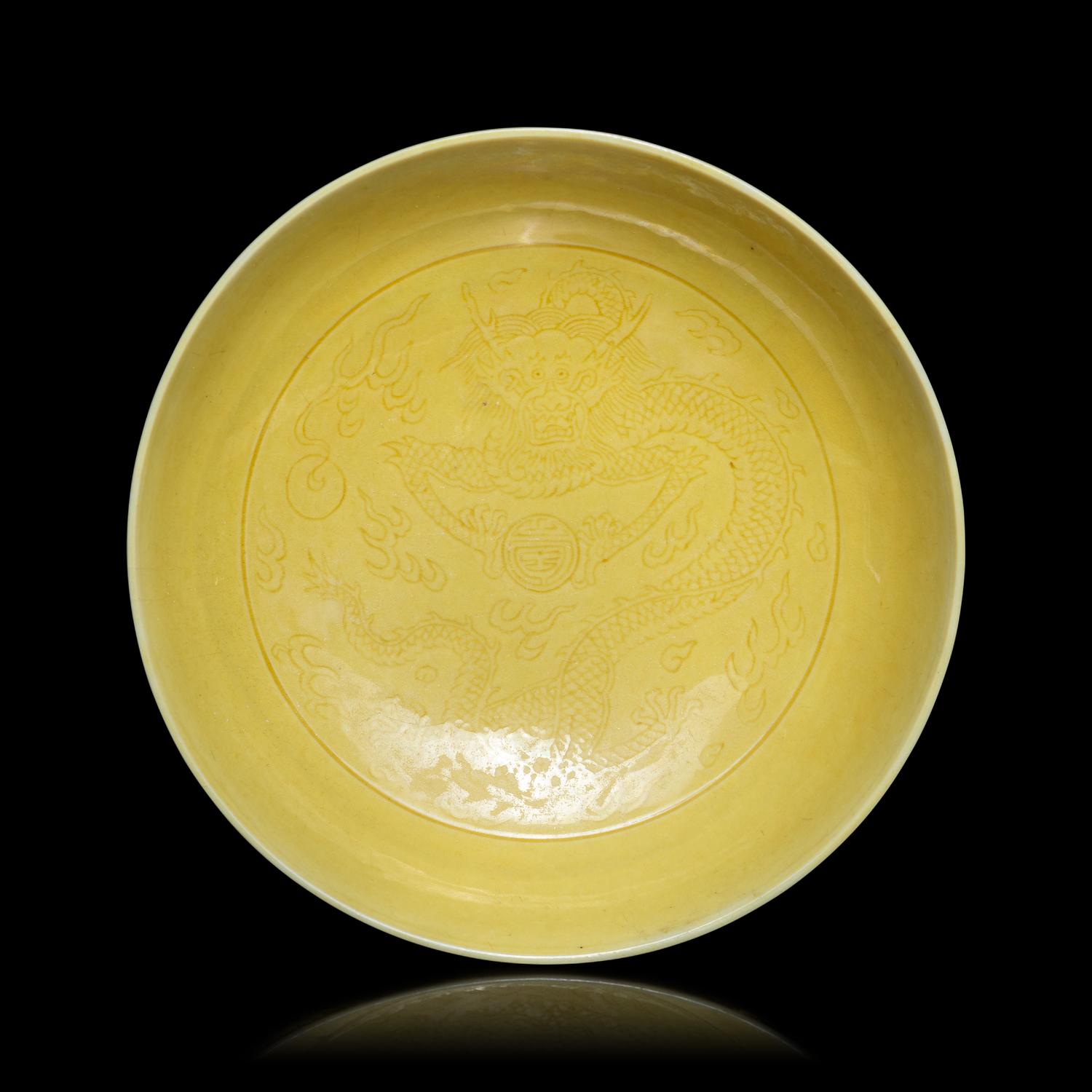 A Pair of Chinese Yellow Glazed Incised Porcelain 'Dragon' Dishes, Qianlong Marks and of the Period 清乾隆 嬌黃釉龍紋碟一對