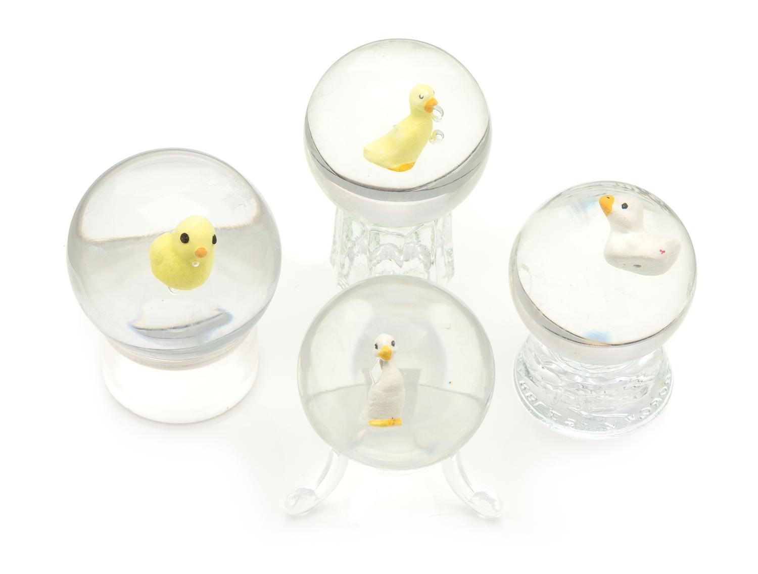 A Group of Four Sulphide Glass Marbles Diameter of largest 2 1/4 inches
