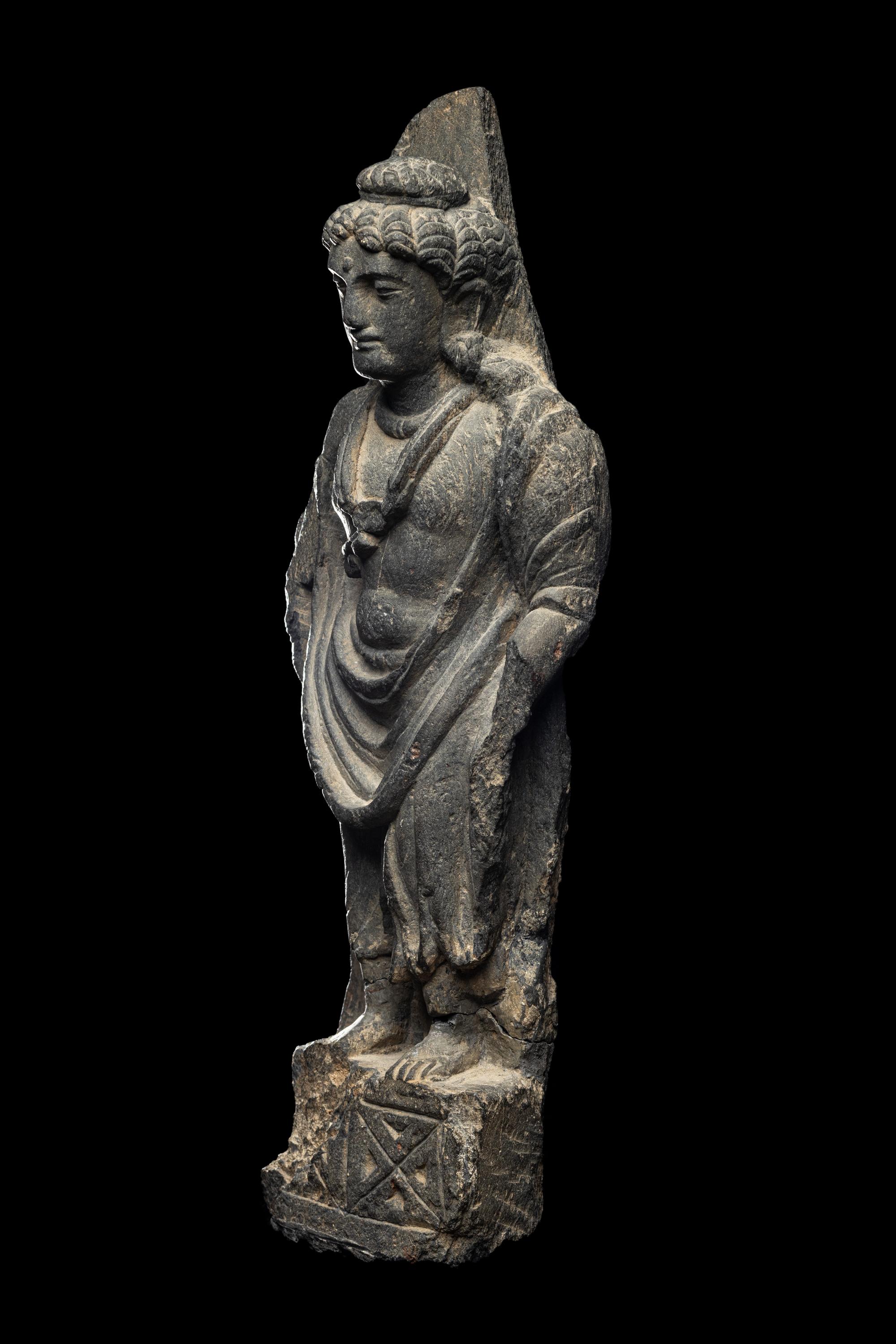 A Gandharan Grey Schist Figure of Maitreya