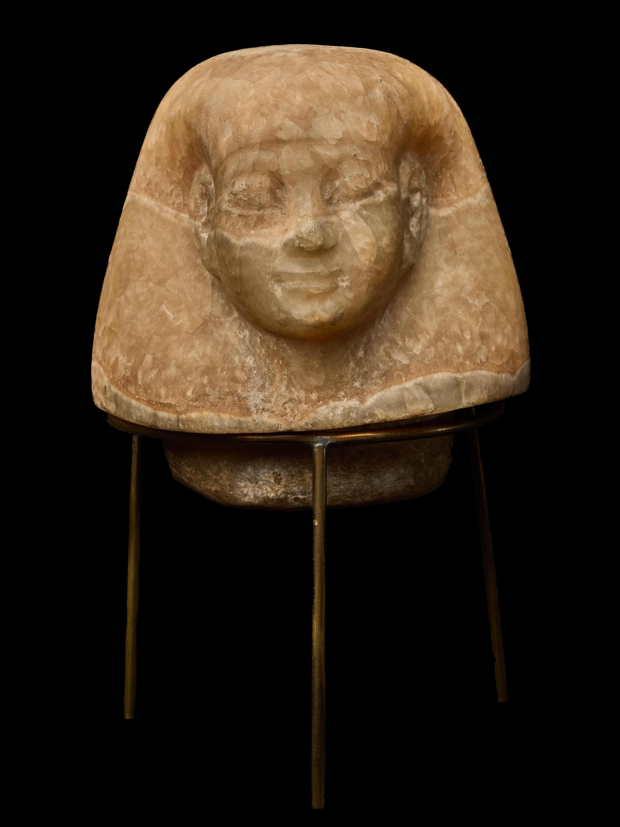 An Egyptian Alabaster Canopic Jar Lid