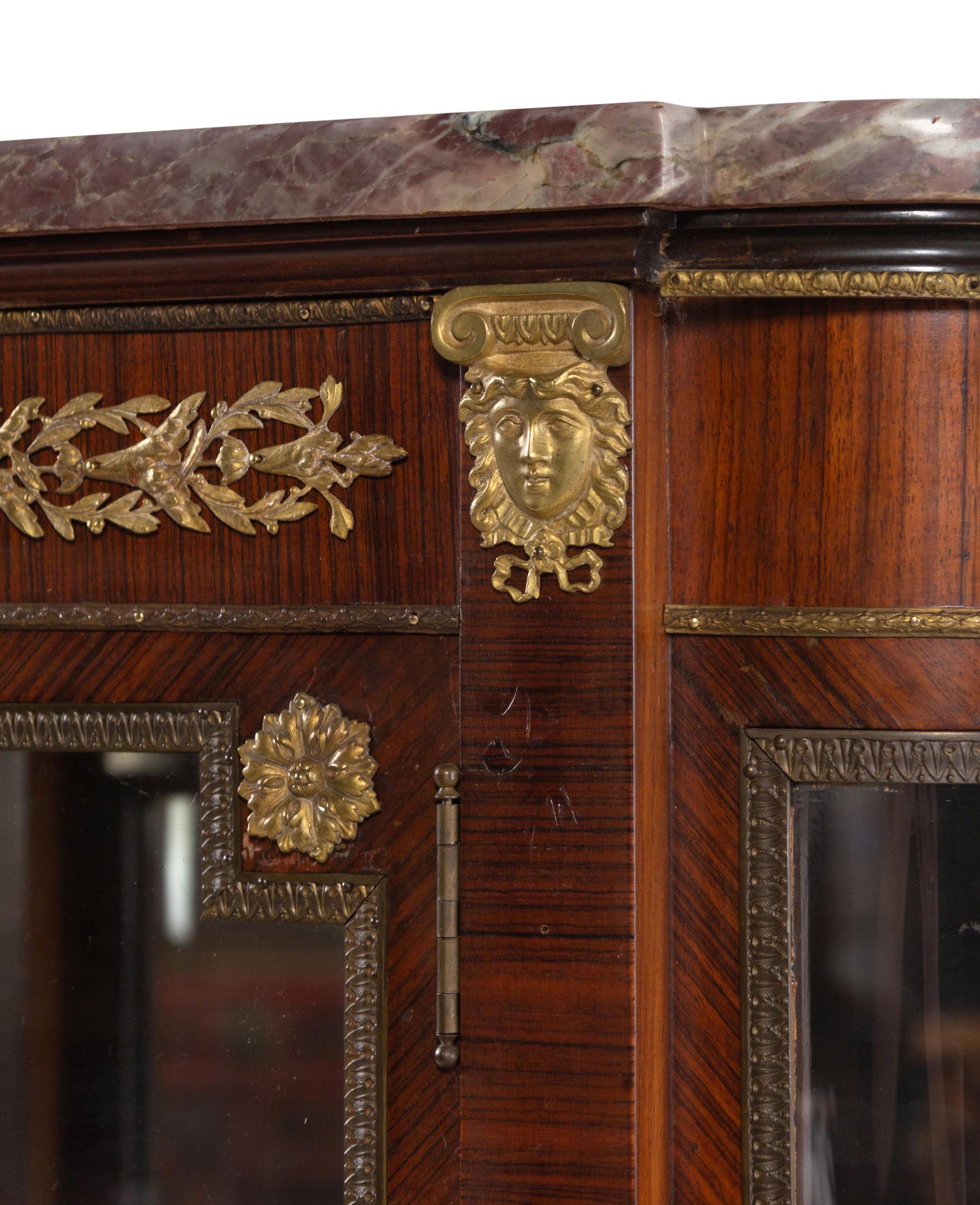 A Louis XVI Style Gilt Bronze Mounted Kingwood Veneered Marble-Top Vitrine Cabinet
