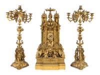 A French Gothic Revival Gilt Bronze Clock Garniture Height of mantel clock 31 3/4 inches. — 19TH CENTURY