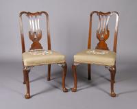 A Pair of George III Walnut Side Chairs, Height 38 1/4 inches.