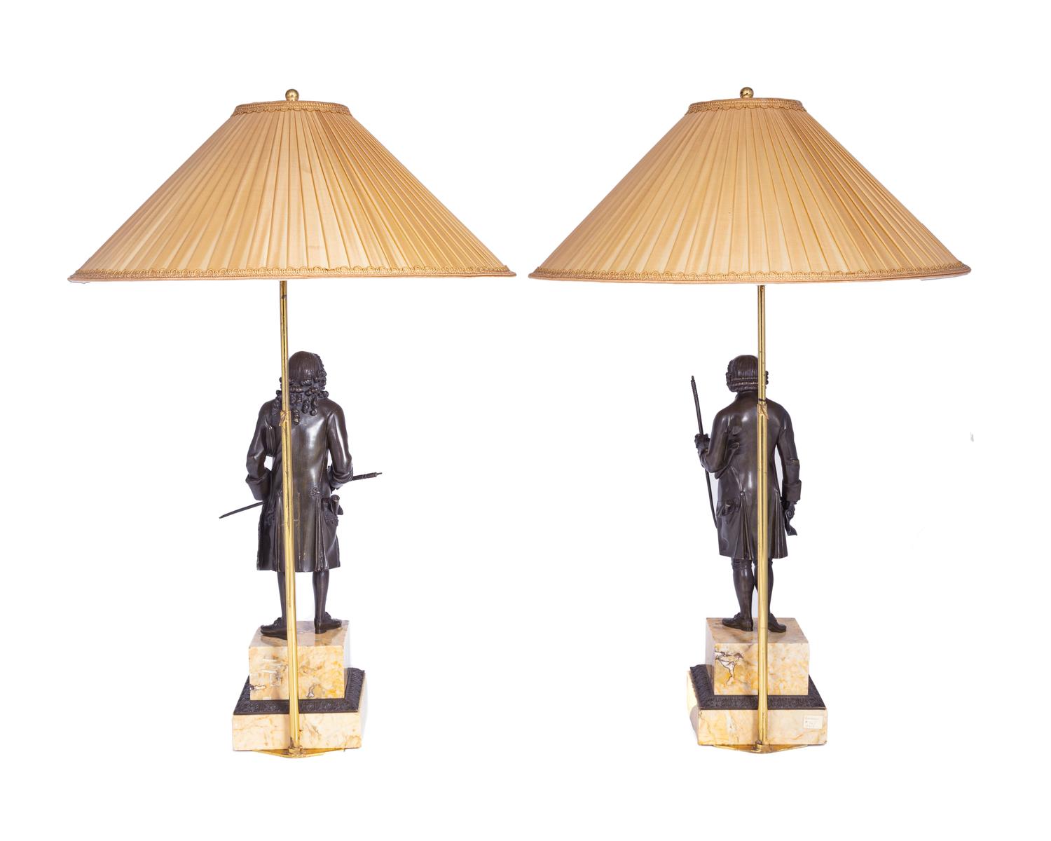 A Pair of French Bronze and Sienna Marble Sculptures of Voltaire and Rousseau