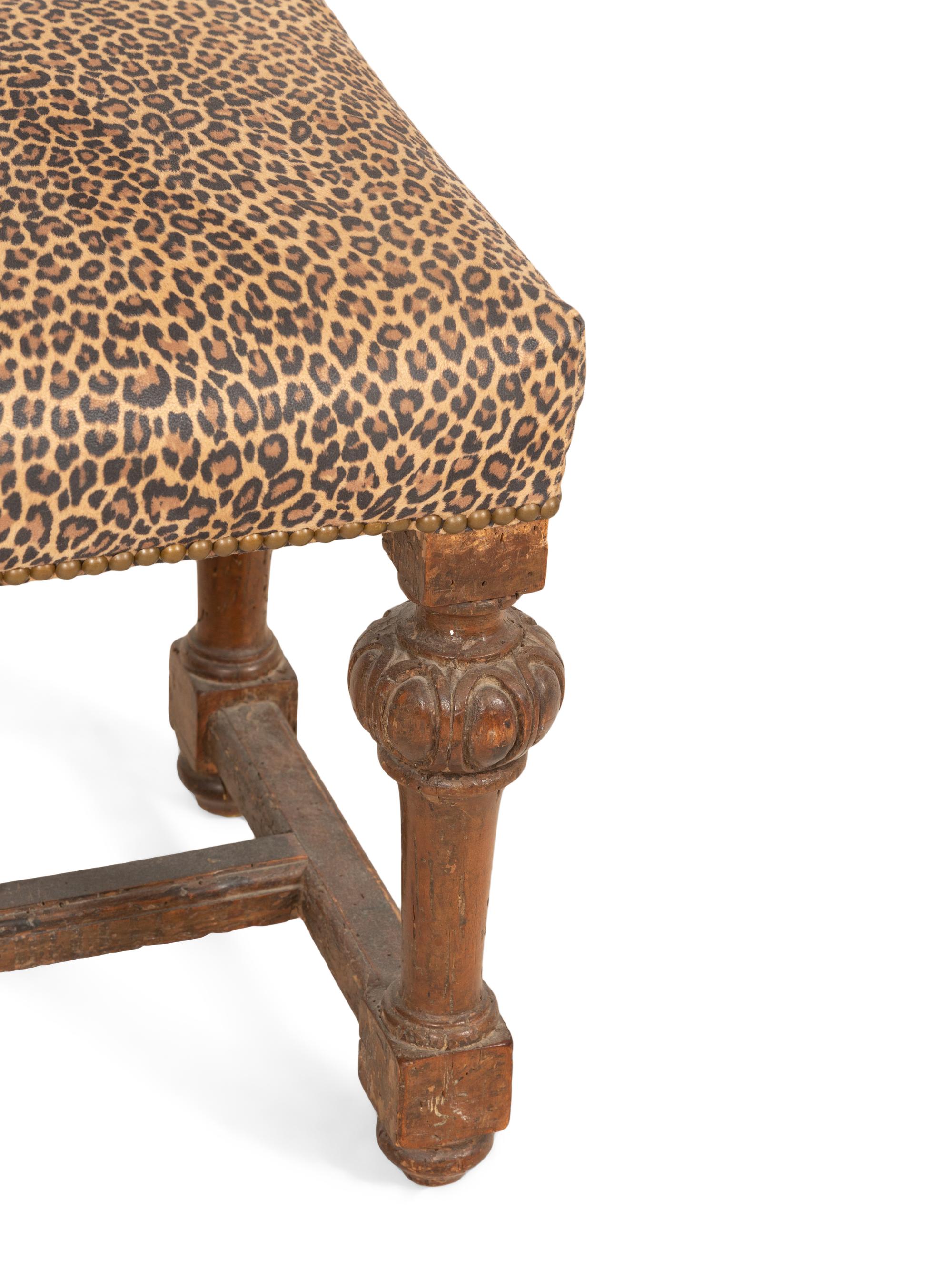 A Louis XIV Carved Walnut Tabouret with Leopard Print Upholstery