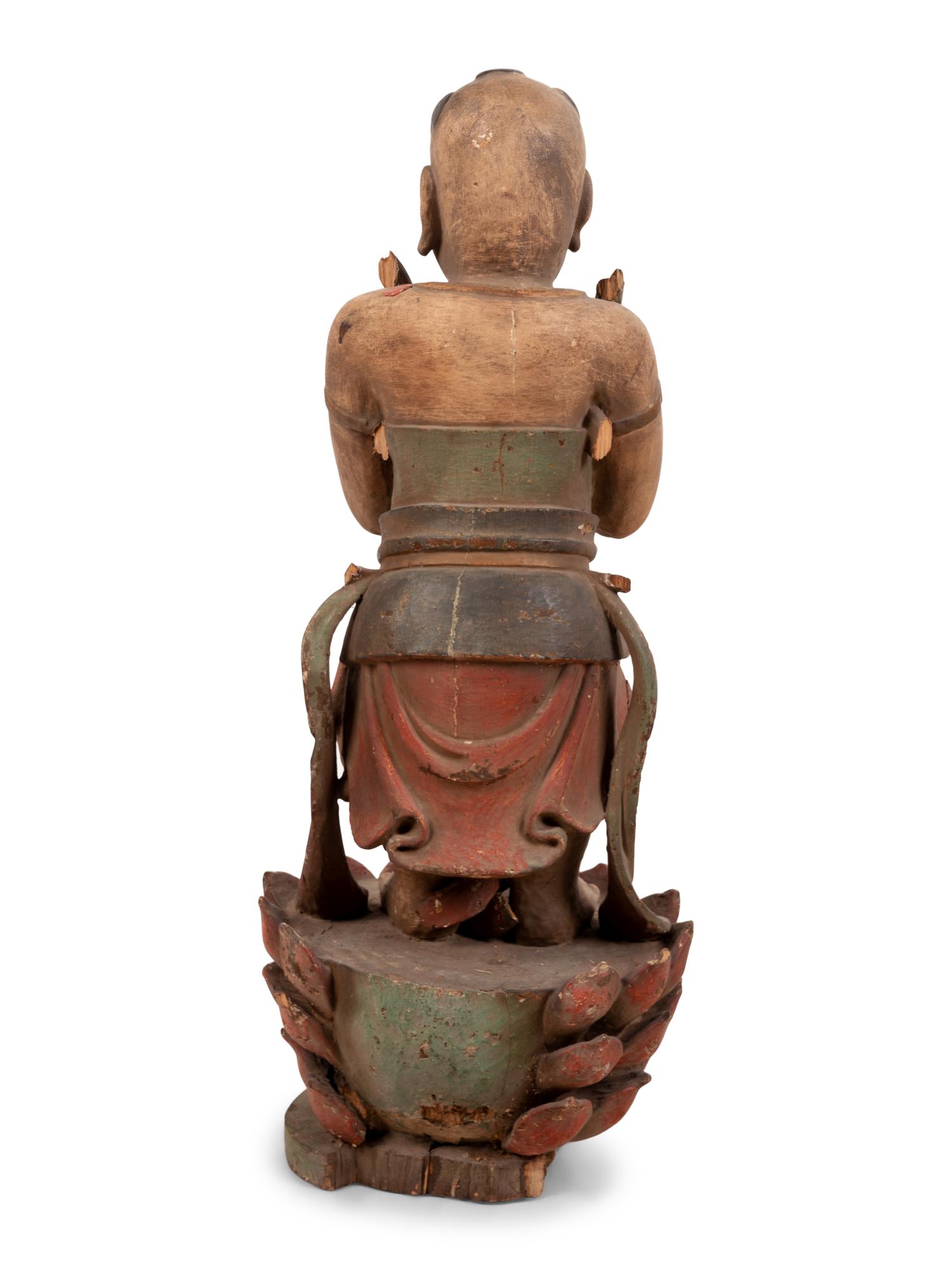 A Chinese Carved Wood Standing Figure with Polychrome Decoration