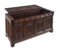 A Gothic Revival Carved Oak Chest
