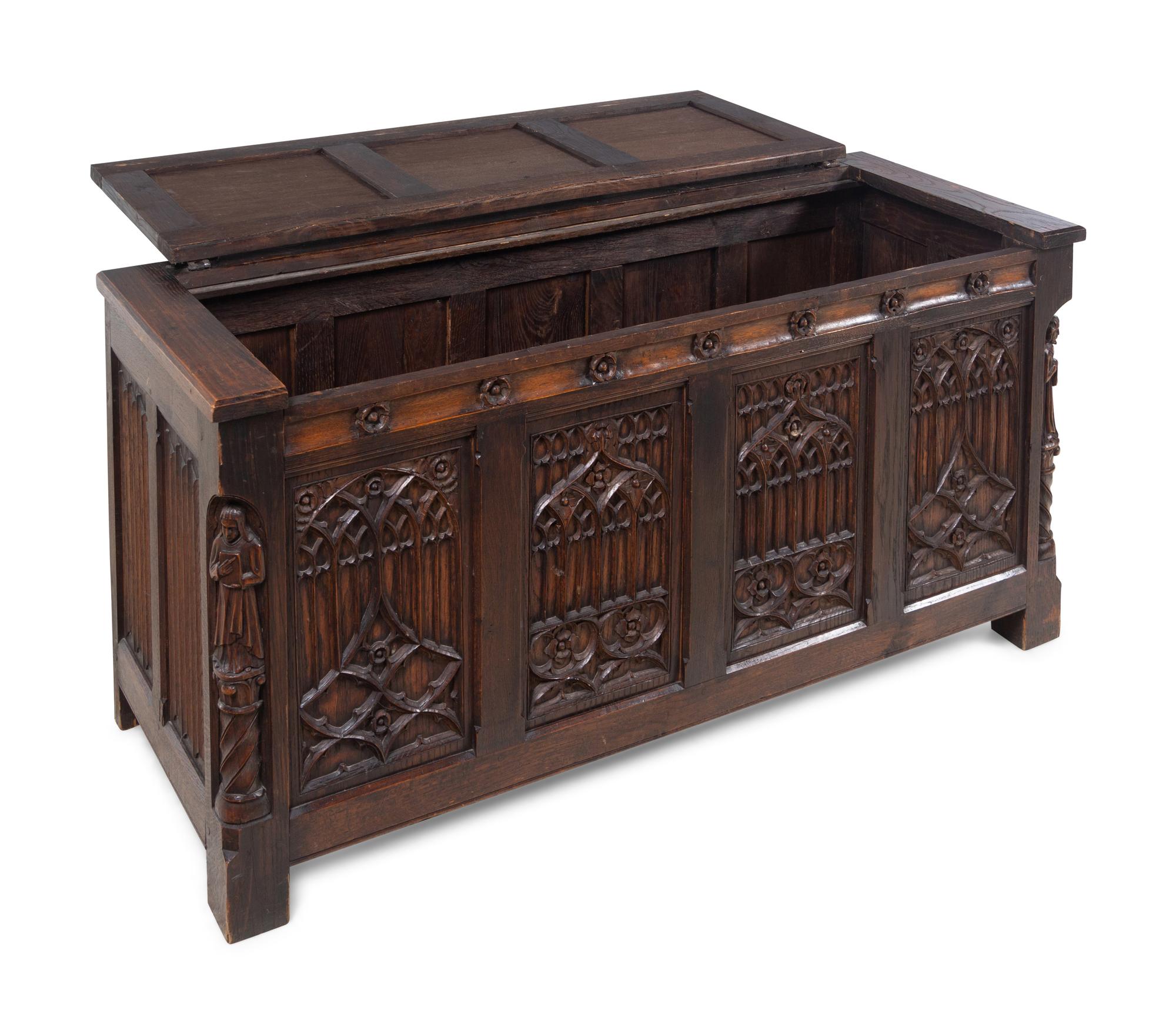 A Gothic Revival Carved Oak Chest