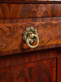 A Late Classical Carved and Highly Figured Mahogany Sideboard